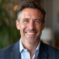 Michael P., a smiling man in his late 40s, looking healthy and vibrant.